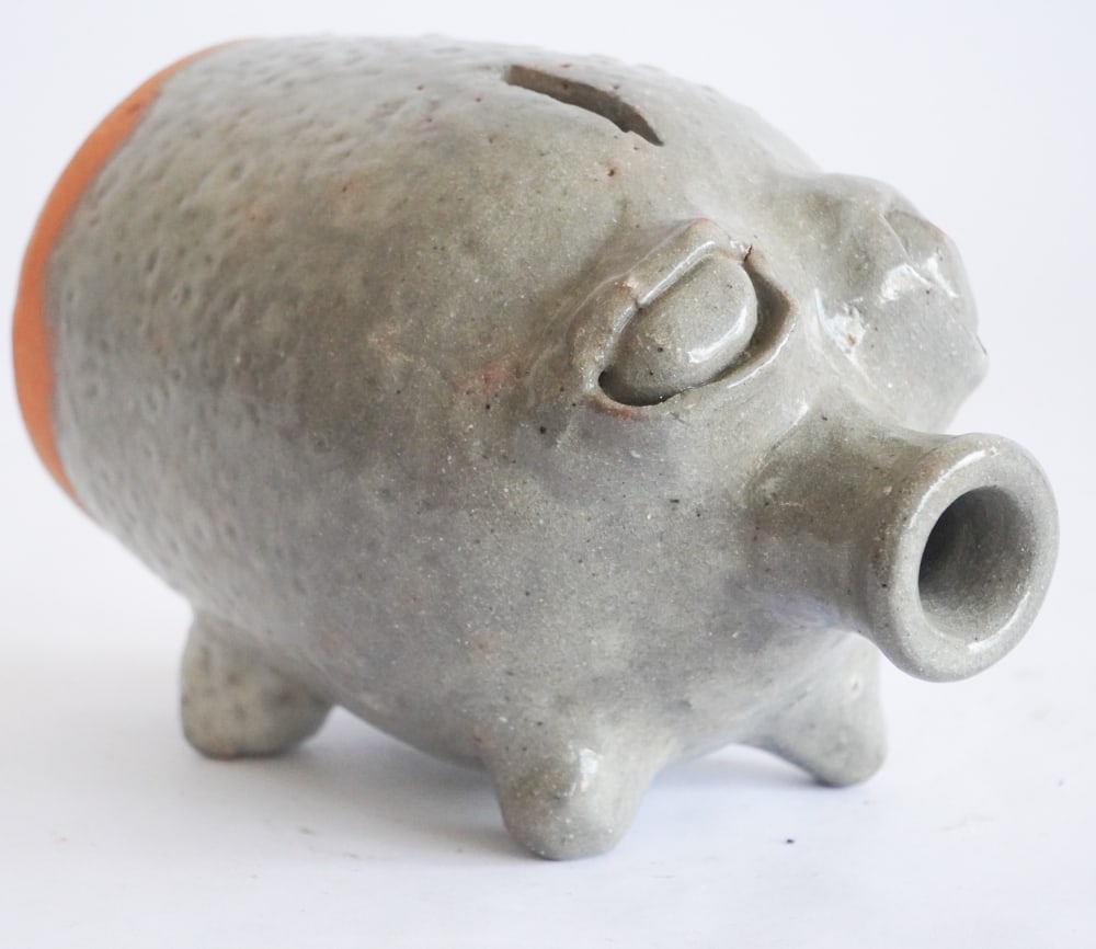 Uncommon North Carolina Figural Stoneware Pig Bank by Burlon Craig: Circa 1970, Vale, North Carolina. Very charming example with a light colored glaze. Good condition signed at the base. L7 1/4"