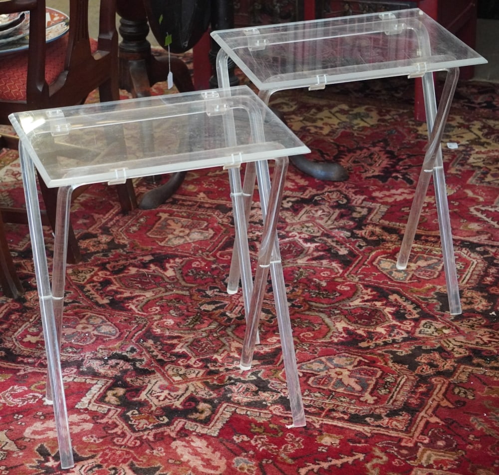 Excellent Mid Century Lucite Deco Folding Tables: Mid to later 20th century. Brilliant pair with rectangular tops on folding bases. Good well kept condition. H25 1/2" W20 1/4" D15 1/4" Sold from the collection of a Camden, South Carolina couple.