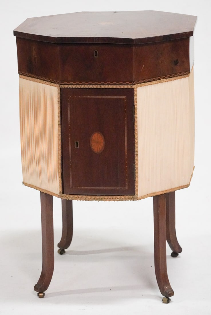English George III Inlaid Mahogany Sewing Stand: Circa 1820. Having octagonal case nicely inlaid at center opening to brilliantly appointed interior having excellent satinwood lids over compartments all top case with checker inlaid edge on four hand