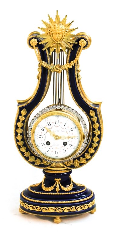 Exceptional French porcelain & ormolu lyre clock: for Theodore B. Starr, New York, Paris, late 19th century. blue porcelain case with ormolu mounts retaining 'ring of brilliants' compound pendulum surrounding dial marked Theodore B. Starr, New York""