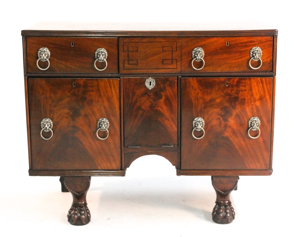 Fine Regency carved-mahogany double cellarette: circa 1830. H33 3/4 W41 7/8" D21 1/4""