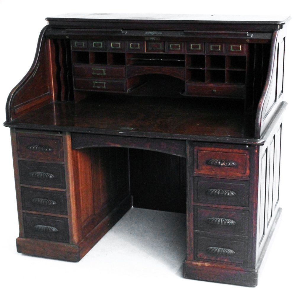 American carved oak roll top city desk: circa1900. H49 1/4 W53 5/8" D36""