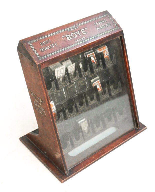 American advertising cabinet, Boyle Sewing Needles: having all bins and several needles. H11 3/4 W12" D7 1/4""