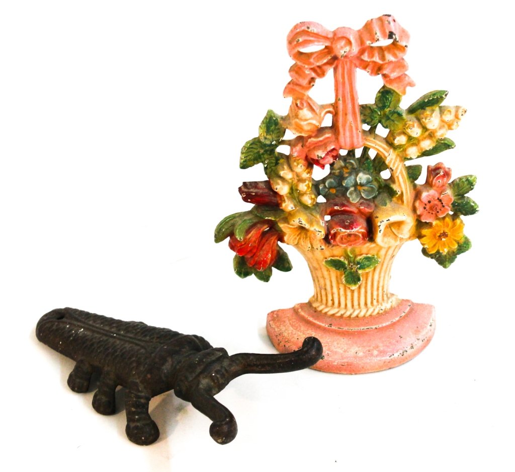 American iron doorstop and boot jack: circa 1890. boot jack signed Robertson & Tober, Rochester, NY". largest: H 10 1/2" W7 1/2""