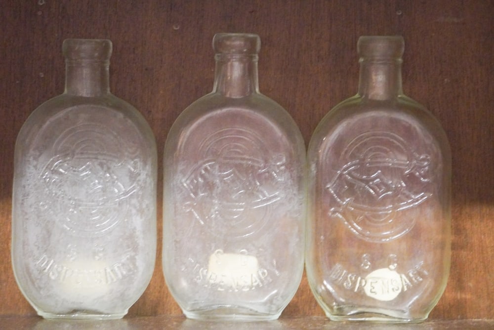 Collection Three South Carolina Dispensary Bottle JoJo Flasks 1/2 Pints: Circa 1900. Handsome collection of three jojo flasks in well kept condition overall. H6 3/4"