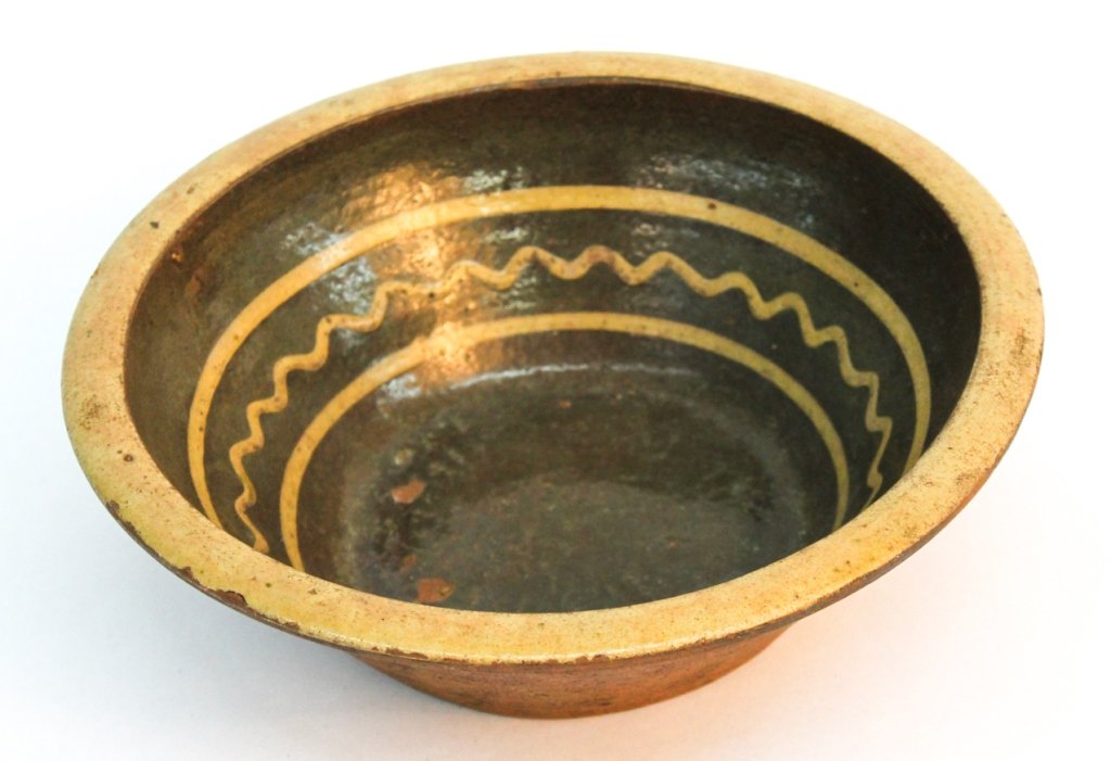 American decorated redware bowl: possibly North Carolina, circa 1850. H3 1/4'' W10 1/2'' Private Upcountry South Carolina estate.