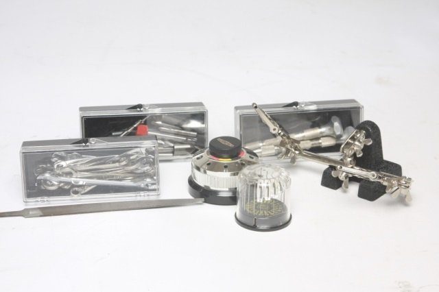 Collection of clock tools and parts: including: screwdrivers, files, pin vises, tap and die set and saws.