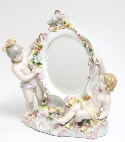 Meissen German porcelain dressing mirror: 19th century. with hand painted putti and floral relief. bearing mark on verso. H14" W13 1/2"