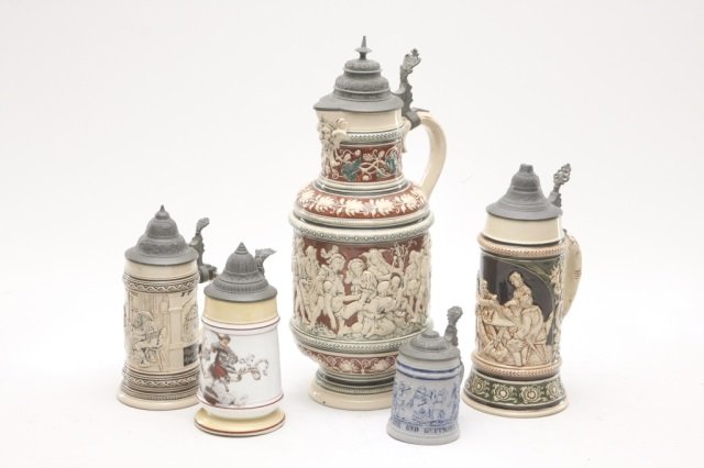 Five assorted earthenware beer steins: largest bears incised maker's mark of Simon Peter Gerz of Sessenbach, Germany and is decorated in one of Gert’s traditional scenes of townspeople and drinkers. remaining four topped with pewter lids