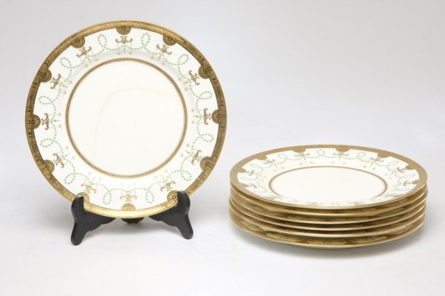 Neoclassical style Minton porcelain dinner plates: English. raised gold and green detailing on an ivory ground, gold border with Neoclassical motif. printed and incised marks on reverse, pattern H1469. retailed by Bailey, Banks & Biddle of Philadelphi