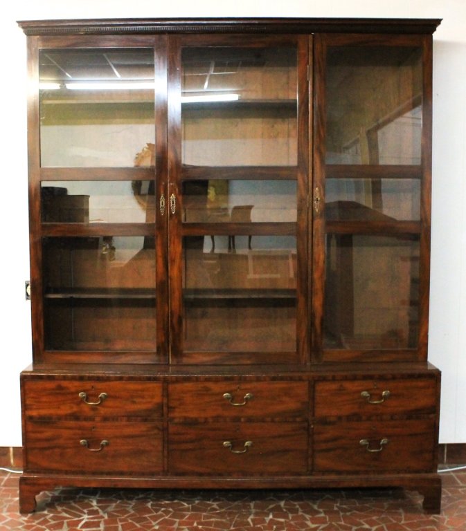 George III Mahogany Breakfront: late 18th century. dentil-molded cornice above three-section bookcase on base with six drawers. H94" W79 1/2" D22 3/4"