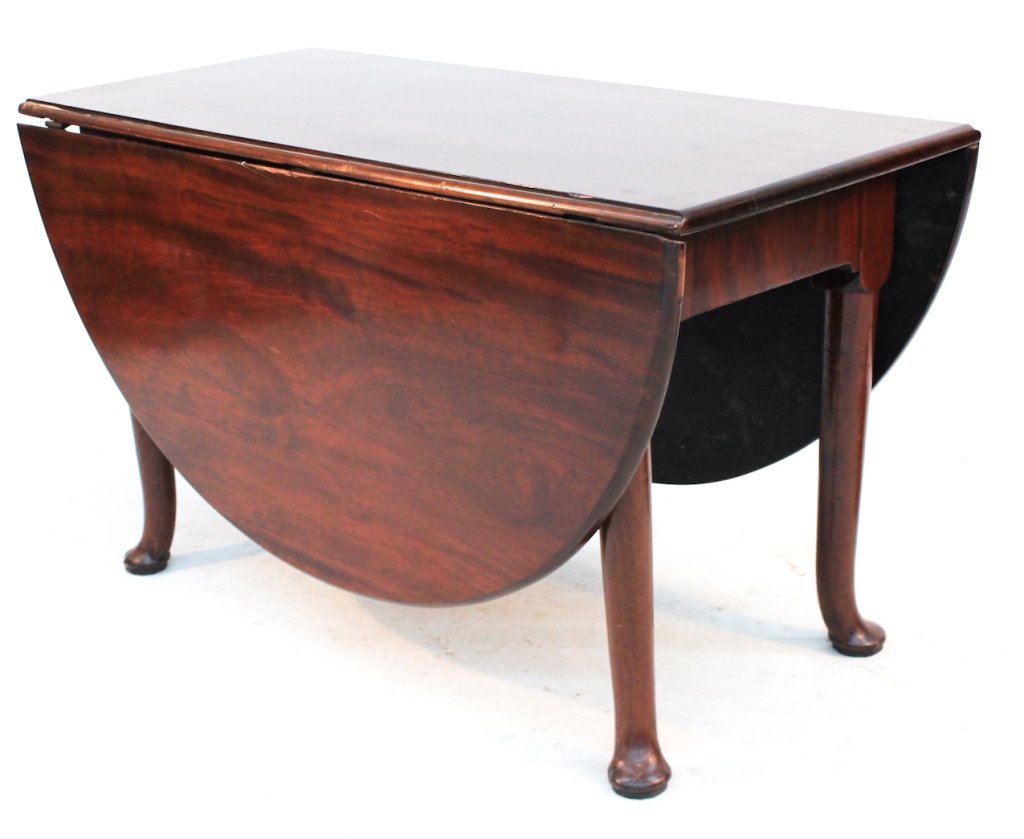 Queen Anne Mahogany Drop Leaf Table: Britain, circa 1780. constructed of rich Cuban mahogany. H28" W67" D48"