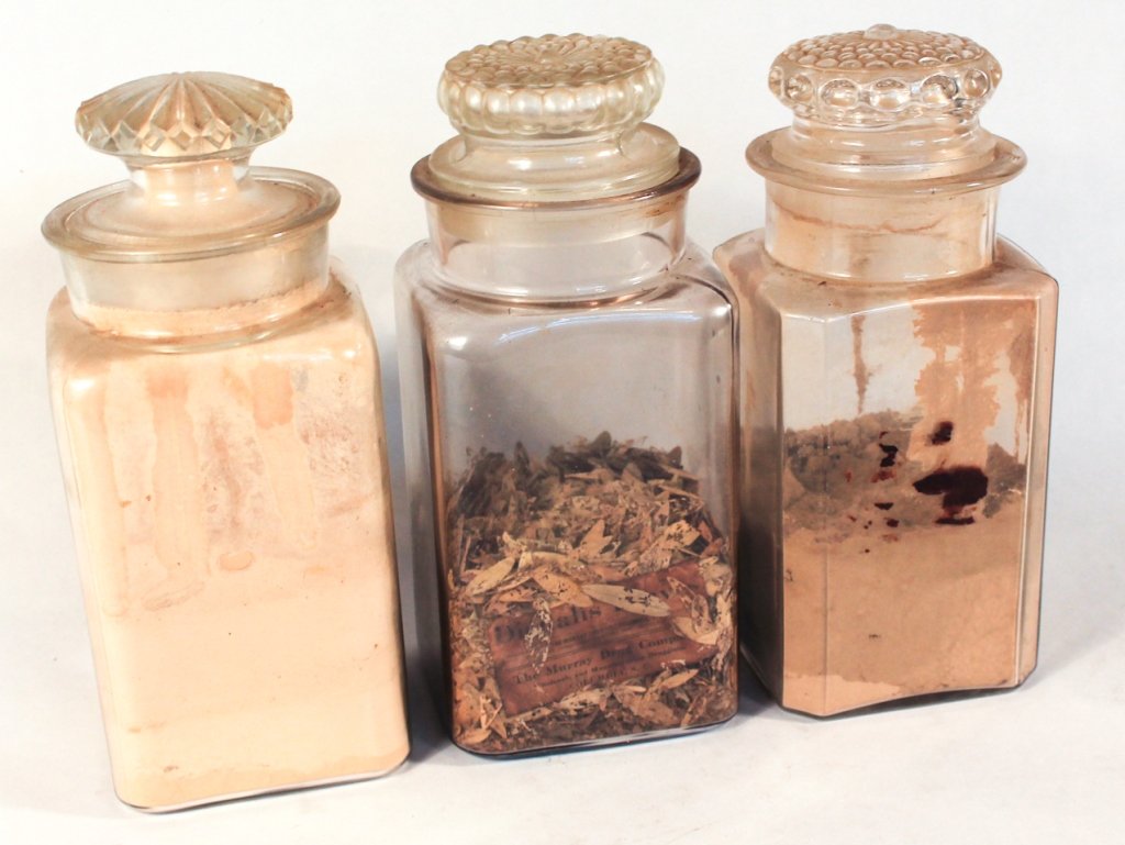 Group of Three Drugstore Apothecary Jars: circa 1900. retaining original contents. one jar with early label reading "Murray Drug Company Columbia, SC". H11 1/2" W5"