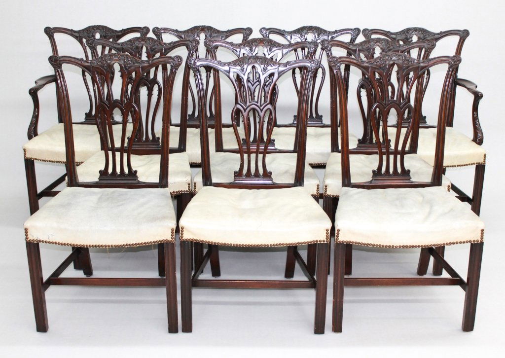 Set of Ten Chippendale Style Dining Chairs: late 19th/early 20th century. two arm chairs, eight side chairs with carved backs and pierced splats on square molded legs. H40 1/2" SH19" W24" D23" Main Line Philadelphia Private Collection.