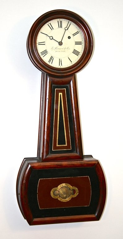 E. Howard & Co.#5 Banjo Clock, Boston: mid-19th century. original grain-painted case housing signed movement, original dial, glasses, weight and pendulum. H28 1/2" W12"