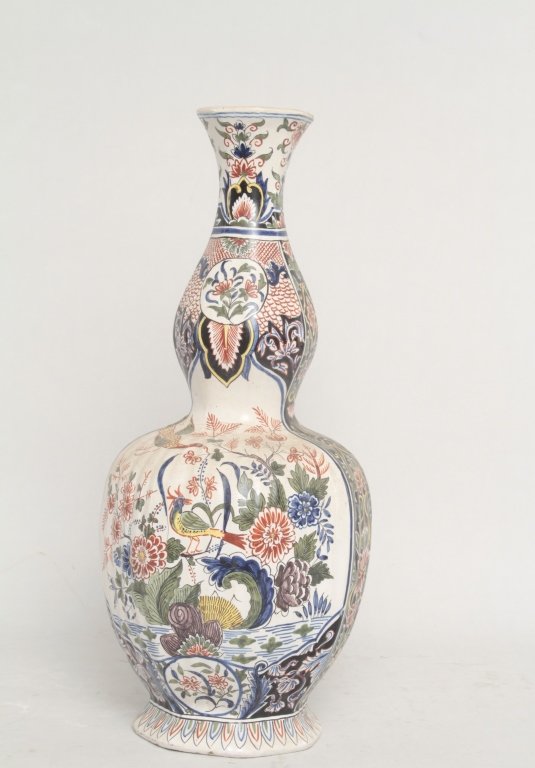 Large Antique Delft Pottery Vase: 18th or 19th century. exhibiting bright and vivid decoration surrounding body. old staple repair amid body. H17" From the Estate of Anita Hill, Jupiter, Florida.