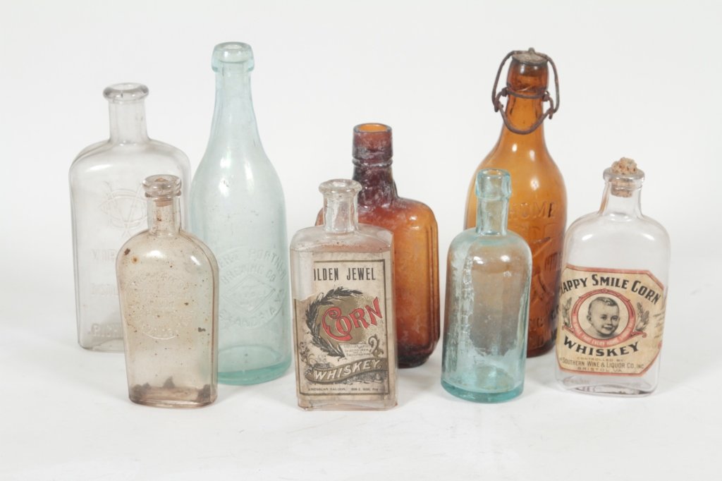 Eight Vintage Bottles of Southern Interest: to include aqua beer bottle, Robert Portner Brewing Co., Alexandria, VA, H9 1/8"; clear Virginia Distilling Corp., Richmond, VA, H7 5/8"; amber Home Brewing Co., Richmond, VA, H8 1/4"; clear Happy Smi