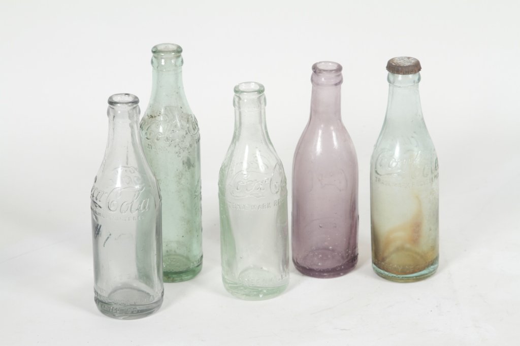 Five Vintage Coca-Cola Bottles, Greenville, SC: to include three straight-sided, shoulder script, H7 1/2"; straight-sided, shoulder script with mid-body slug plate "Verner Springs Water Co. Greenville, SC, 6oz.." H8 1/4"; straight-sided, mid body s