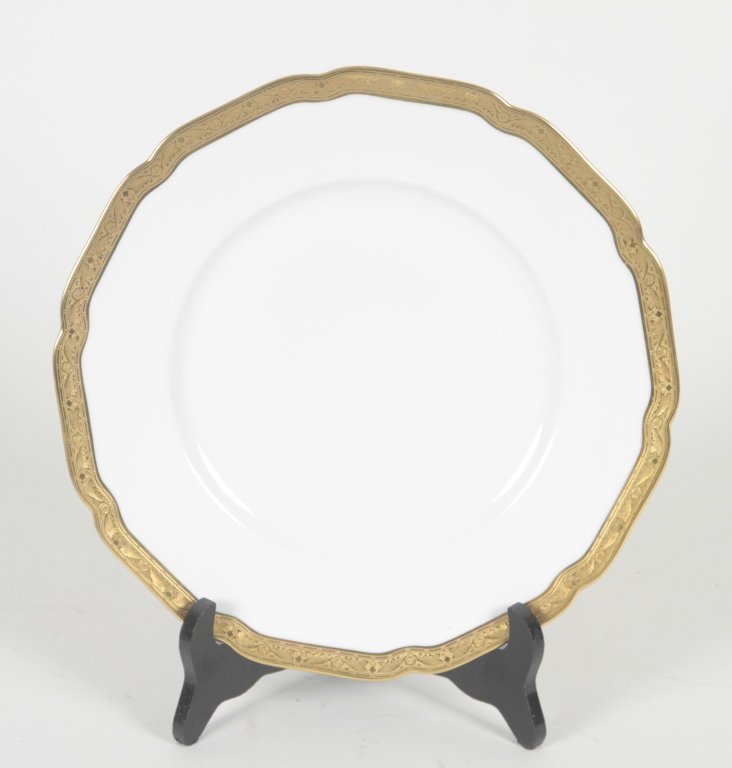 Twelve Hutschenreuther Porcelain Dinner Plates: Hohenberg, Germany. gold-rimmed plates with a solid white ground. bearing hallmarks on underside. Dia. 10 ½” From the Private Collection of Mr. Carl Butler, Clayton, Georgia.