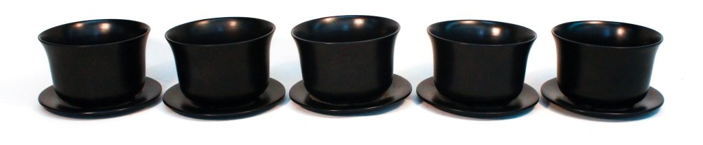 Elsa Peretti for Tiffany & Co. Ceramic Flower Pots: set of five black planters and underplates bearing hallmarks on base. H5” W7 ½” From a Private Southampton, New York Estate.