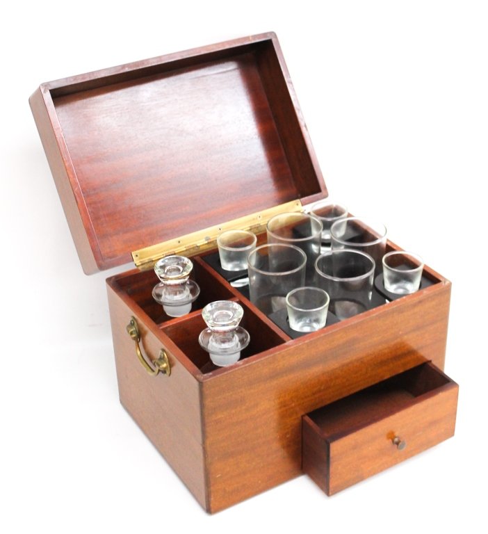 Mahogany Cased Liquor Chest: 20th century. fitted box with carrying handles and hinged lid retaining two bottles and eight glasses. H10 3/4" W13 1/2" D9 1/2"