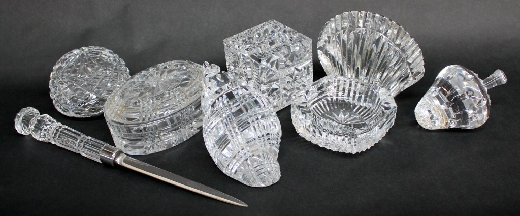 Collection of Waterford Crystal Objects: 20th century. consisting of strawberry, shells, cube, orb, cigerette tray and letter opener. 8 pieces From the Private Collection of Mr. Carl Butler, Clayton, Georgia.