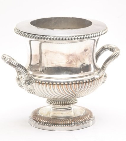 George III Style Old Sheffield Plate Wine Cooler: English, 19th century. gadrooned lower half and rim, two reeded handles with grape bunches where attached to base. H8 ¾” W10” Main Line Philadelphia Private Collection.