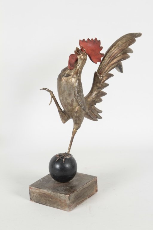 Folk Art Carved & Polychrome Wooden Rooster: early 20th century. mounted on a ball and wooden stand. H16” W5 ¼” From the Private Collection of Mr. Carl Butler, Clayton, Georgia.