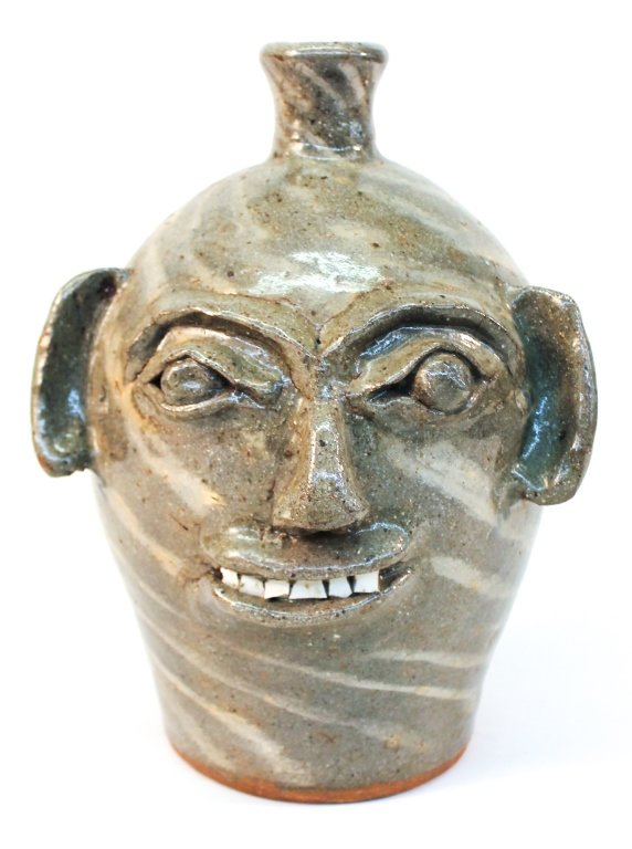 Fine Southern Stoneware Face Jug: Vale, North Carolina. Burlon Craig. bearing stamp at base with precise grey and white body. H12 1/4" W9 1/2" From the Private Collection of Mr. & Mrs. Gary Thompson, Travelers Rest, South Carolina.