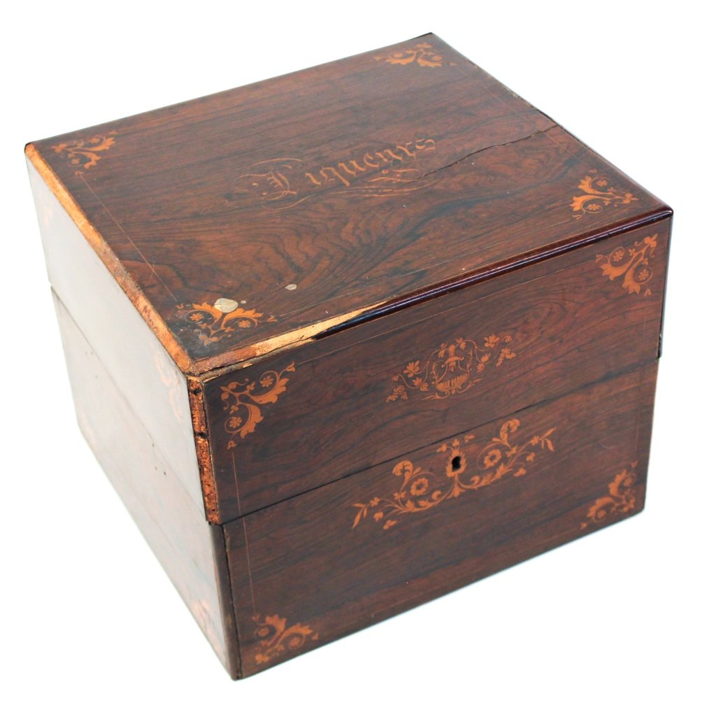 Fine Southern Gothic Revival Rosewood Liquor Box: probably Louisiana or Mississippi, circa 1850. exhibiting exceptional inlaid detail and with its original decanters. family record indicates this box belonged to W.A. Freret. H9 1/2" W12 1/8" D11 1/4"