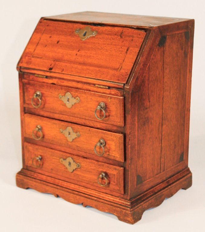 George III Miniature Inlaid Mahogany Desk: late 18th century. slant lid above three drawers on bracket base. the dovetailed case inlaid on top and sides as well as slant lid and drawers fronts. H13 1/8" W11 1/8" D8 1/2" Private Upcountry, Sout