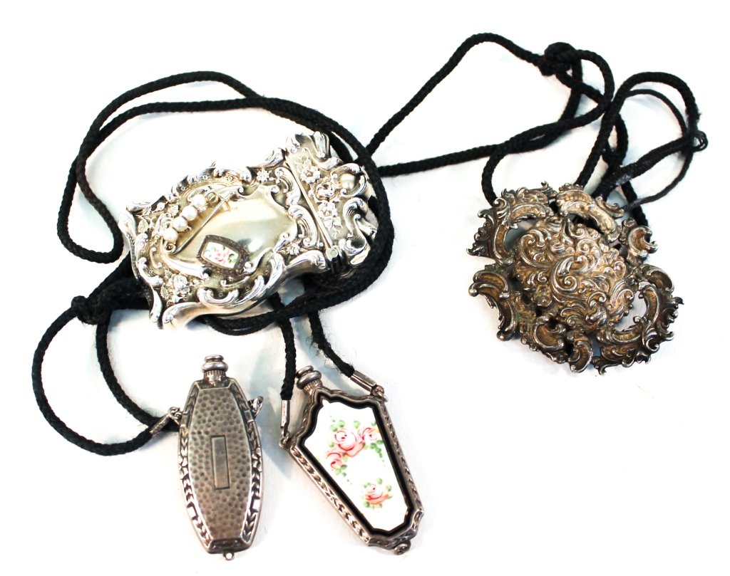 Victorian Silver Lady's Articles and Jewelry: 19th century. collection of belt buckle, match case, two perfume amulets, and perfume pin. 6 pieces. From the Freret Family Collection, New Orleans, Louisiana and Atlanta, Georgia.