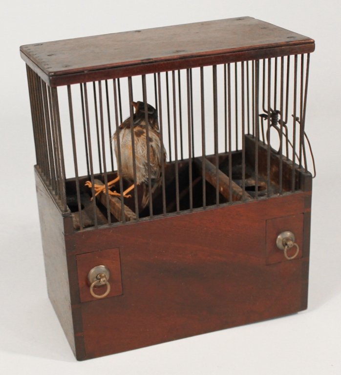 Regency Mahogany Birdcage: early 19th century. dovetailed box with two pull-out seed drawers beneath a wire cage and flat top. H8 1/4" W7 1/4" D4 1/8" Private Upcountry, South Carolina Collection.
