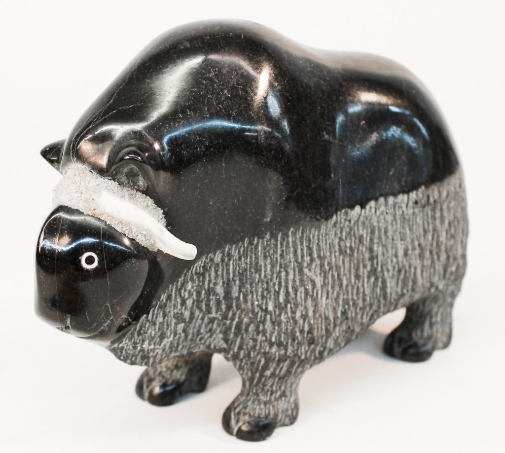 Inuit Carved Stone Musk Ox Sculpture: 1983. signed on base with artists initials. H6 7/8" W3" L9 3/8" Private Atlanta, Georgia Collection.