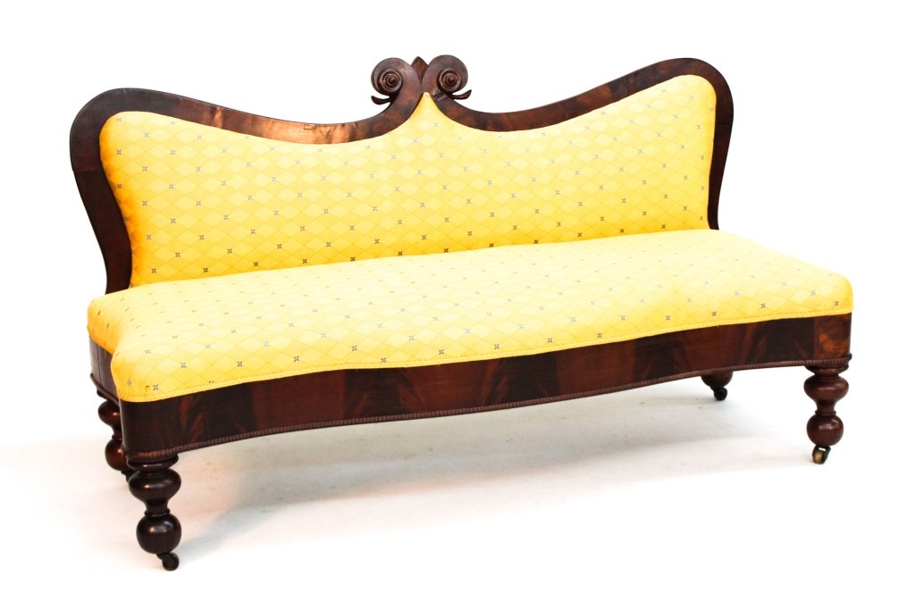 Southern Classical Carved Mahogany Sofa: Virginia, circa 1850. with fine veneers and centered by carved pediment. attributed to Green Brothers. H34" W61" D24"