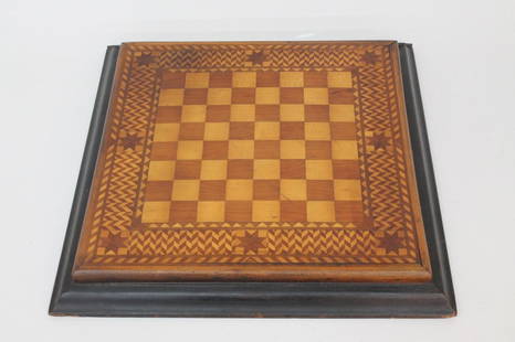 Interesting American Folk Art Game Board: circa 1900. with excellent inlaid mixed wood surface, sliding hidden drawer for game pieces at bottom. H2" W17"