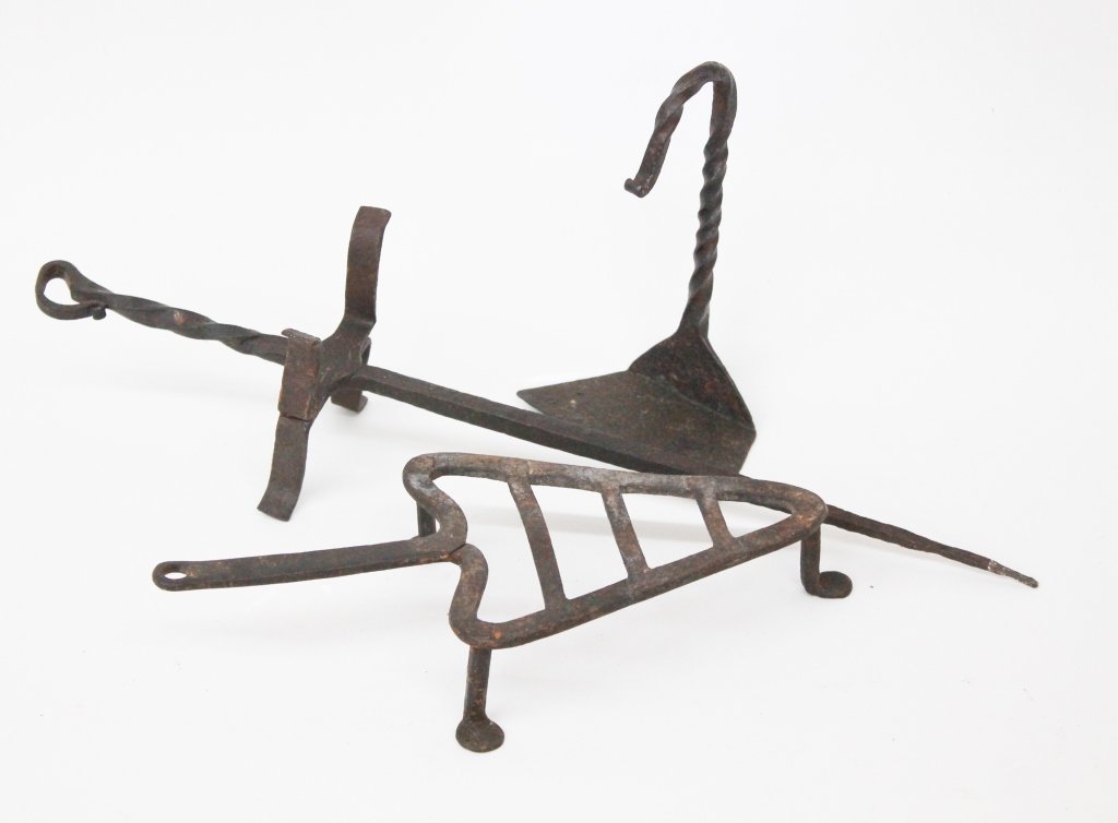 Three Early Iron Hearth Trivets: probably American, 18th or early 19th century. each with fine spiral twist detail. Private Collection of a Carolina Gentleman.