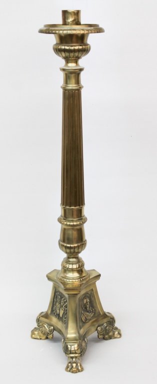 Antique Continental Brass Gothic Candlestick: 19th century. reeded column above religious subjects at base upon paw feet. H36"