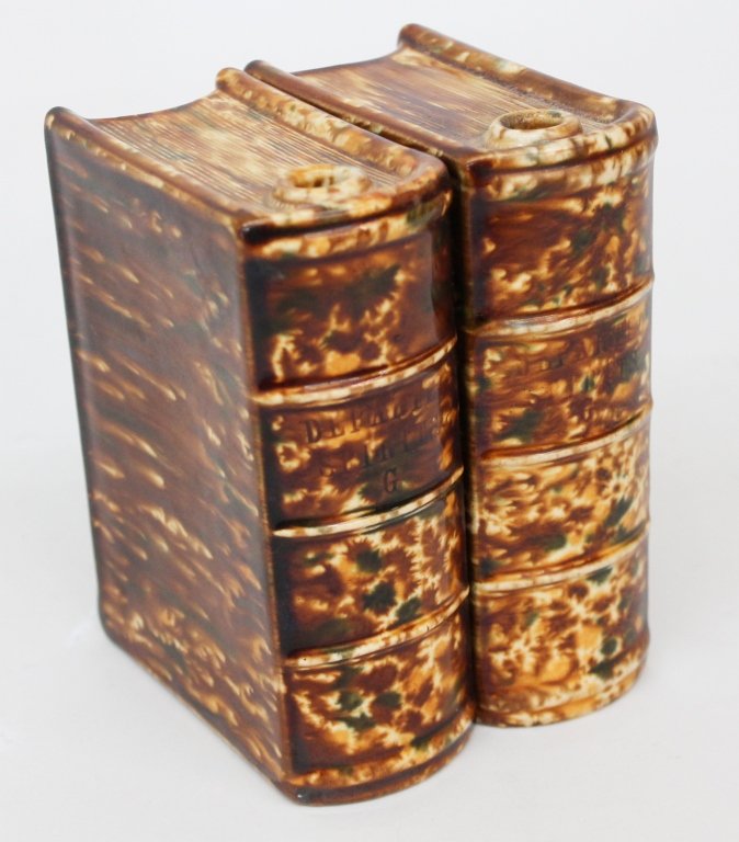 Two Bennington Book Flasks: Bennington, VT, mid 19th century. two pottery book flasks in flint enamel glaze, both titled "Departed Spirits G" H5 5/8" Private Collection of a Carolina Gentleman.
