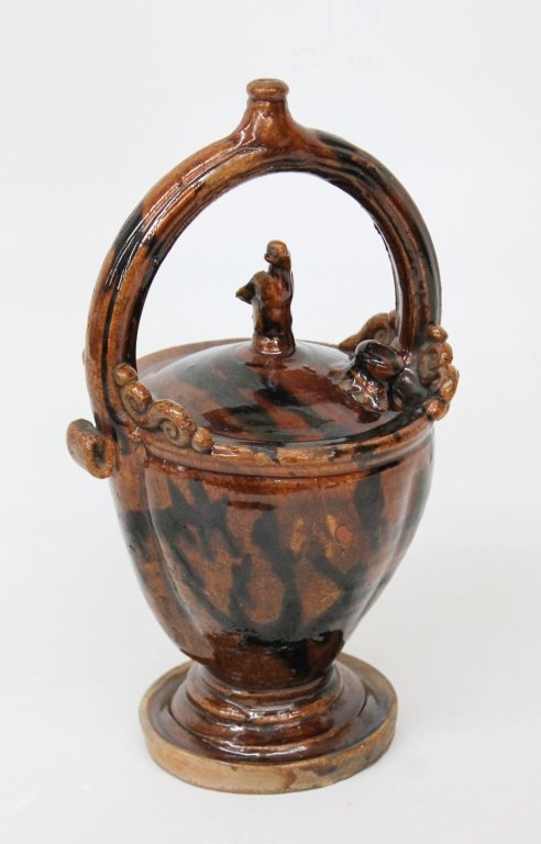 American or British Figural Redware Basket: 19th century. lead glazed with manganese runs and bird finial. having two spouts. H11"