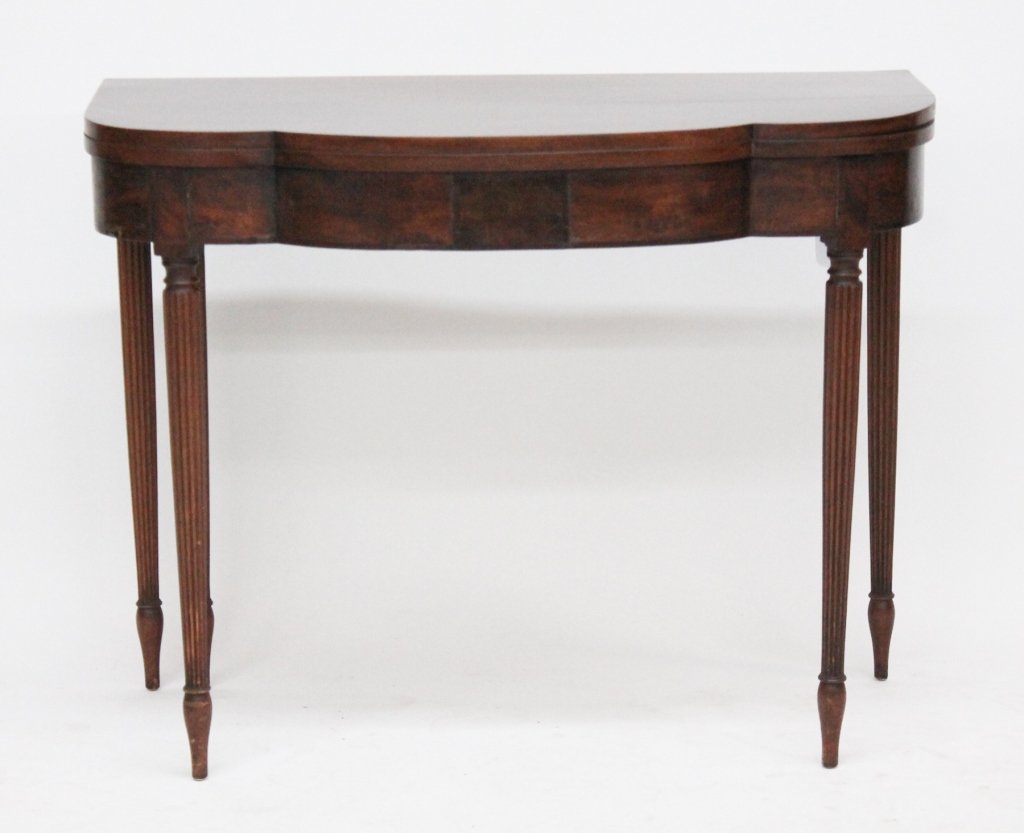 New York Federal Mahogany Card Table: school of Duncan Phyfe, circa 1810. shaped and hinged top above conforming frieze supported by turned and reeded legs terminating in spade feet. H28 1/2" W36 1/2" D35 1/4" (open)