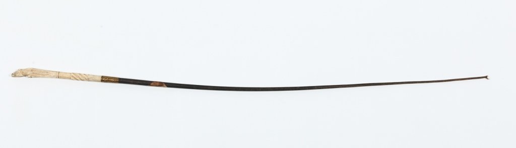Very Fine Antique Whale Bone & Leather Riding Crop: mid 19th century. with well-carved detail of hoof as handle attached to crop. bearing original paper label "whale bone". L30 3/4" Note: From a private historic Ridge Spring, South Carolina home.