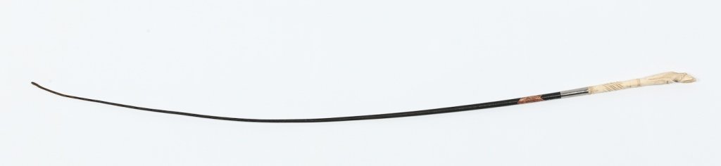 Very Fine Antique Whale Bone & Leather Riding Crop: mid 19th century. with well-carved detail of hoof as handle attached to crop. bearing original paper label "whale bone". L37 1/2" Note: From a private historic Ridge Spring, South Carolina home.