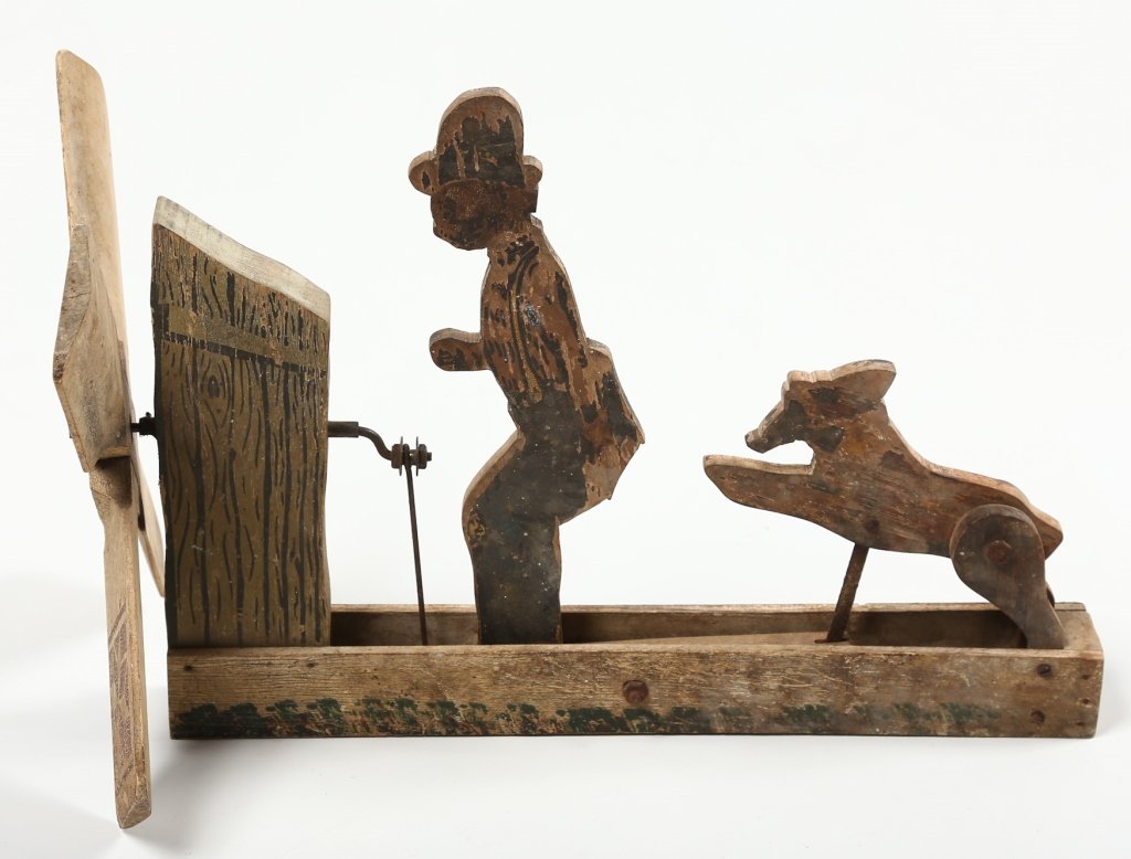Antique American Folk Art Whirly Gig: early 20th century. old painted surface in the form of a goat bucking a man in the rear end. W15 ½”