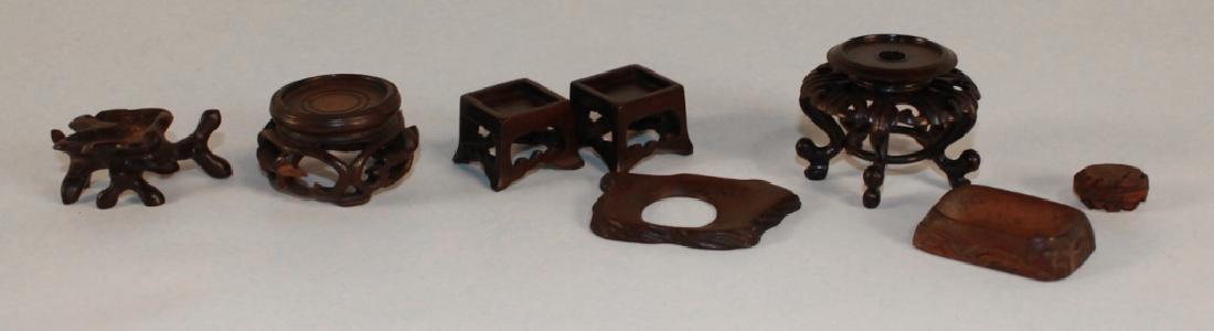 Antique & Vintage Chinese Carved Hardwood Stands: Qing and Republic period. consisting of eight pieces, some of which exhibit excellent form and age. largest: H1 1/2"