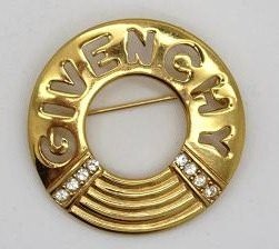 Vintage Givenchy Gold & Rhinestone Logo Pin: Vintage Givenchy Gold & Rhinestone Logo Pinrn Measures 1 and half inches in diameter rn Marked Givenchy on backrn Great Condition