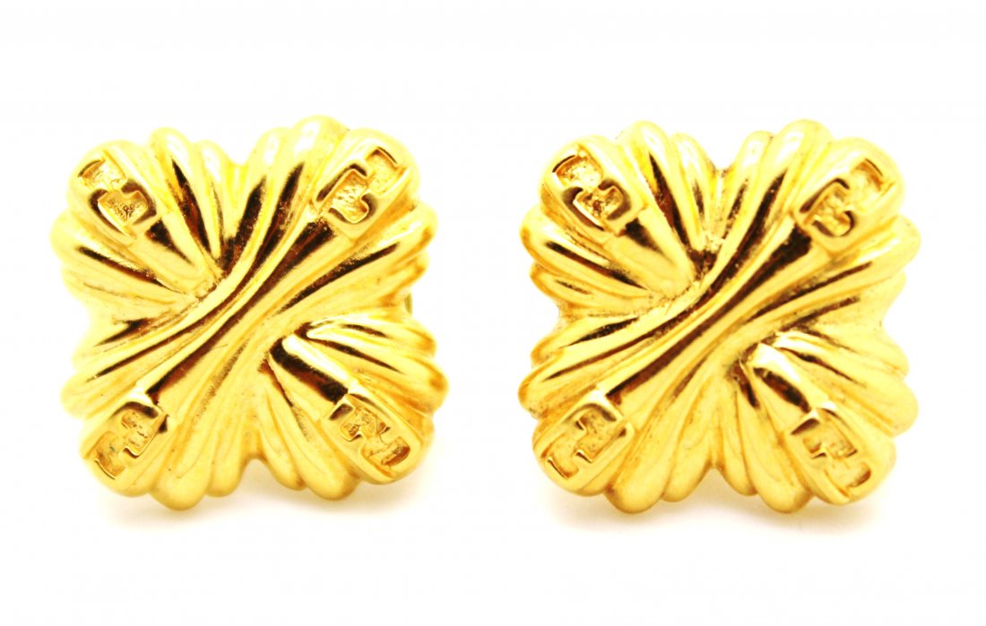 Vintage Unworn New Fendi Logo Gold Earrings: Vintage unworn gold tone Fendi logo earrings "FF" logo on four corners of swirl design Comes on original Fendi earring card Measures 3/4" around 14k gold posts Excellent condition