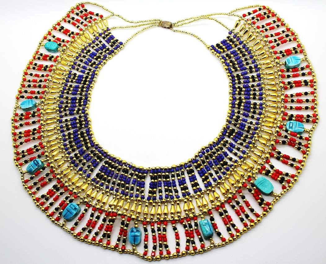 Vintage Egyptian Collar Necklace: Fabulous Egyptian collar with scarab beetles, gold tone, red, black and purple beads. Large size. Measures 14" across, 12" in length & 4" wide.
