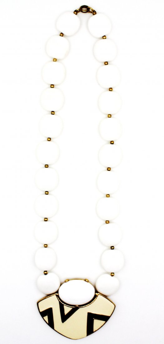 1970's Vintage Trifari Aztec Pendant Bead Necklace: 1970's Vintage Trifari white beaded necklace with gold accents Aztec pendant design in the center measures 2 1/4" 17" in length Good condition