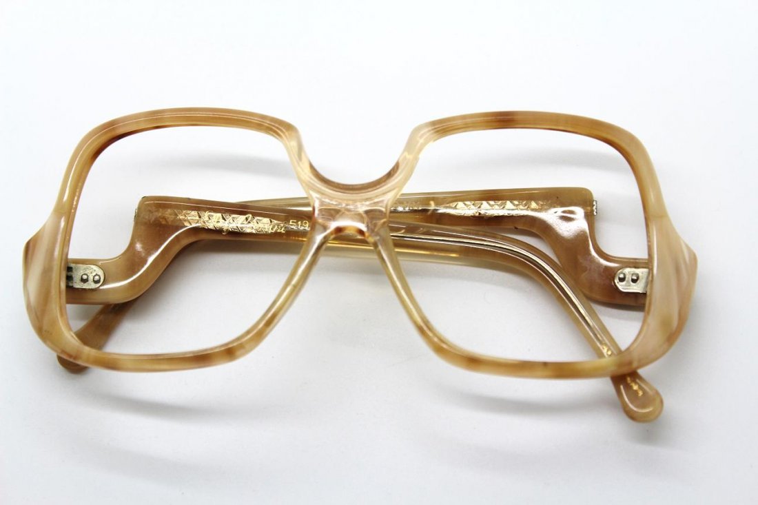 Vintage Oleg Cassini Beige Eyeglass Frames: Signed Oleg Cassini. Beige square eyeglass frames.